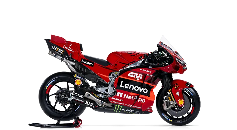 A red racing motorcycle with a sleek design, featuring sponsor logos including Lenovo, Shell, and Monster.