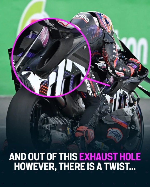 Close-up of a motorcycle exhaust hole with a rider in action, highlighting a unique design feature.